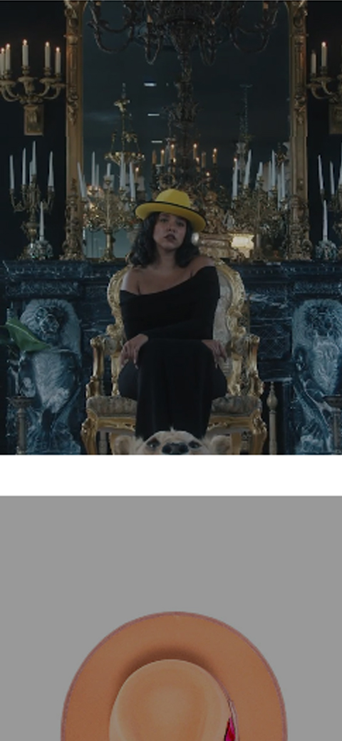 Mobile layout card for Fuego showing female model seated in ornate throne wearing yellow wide-brim fedora