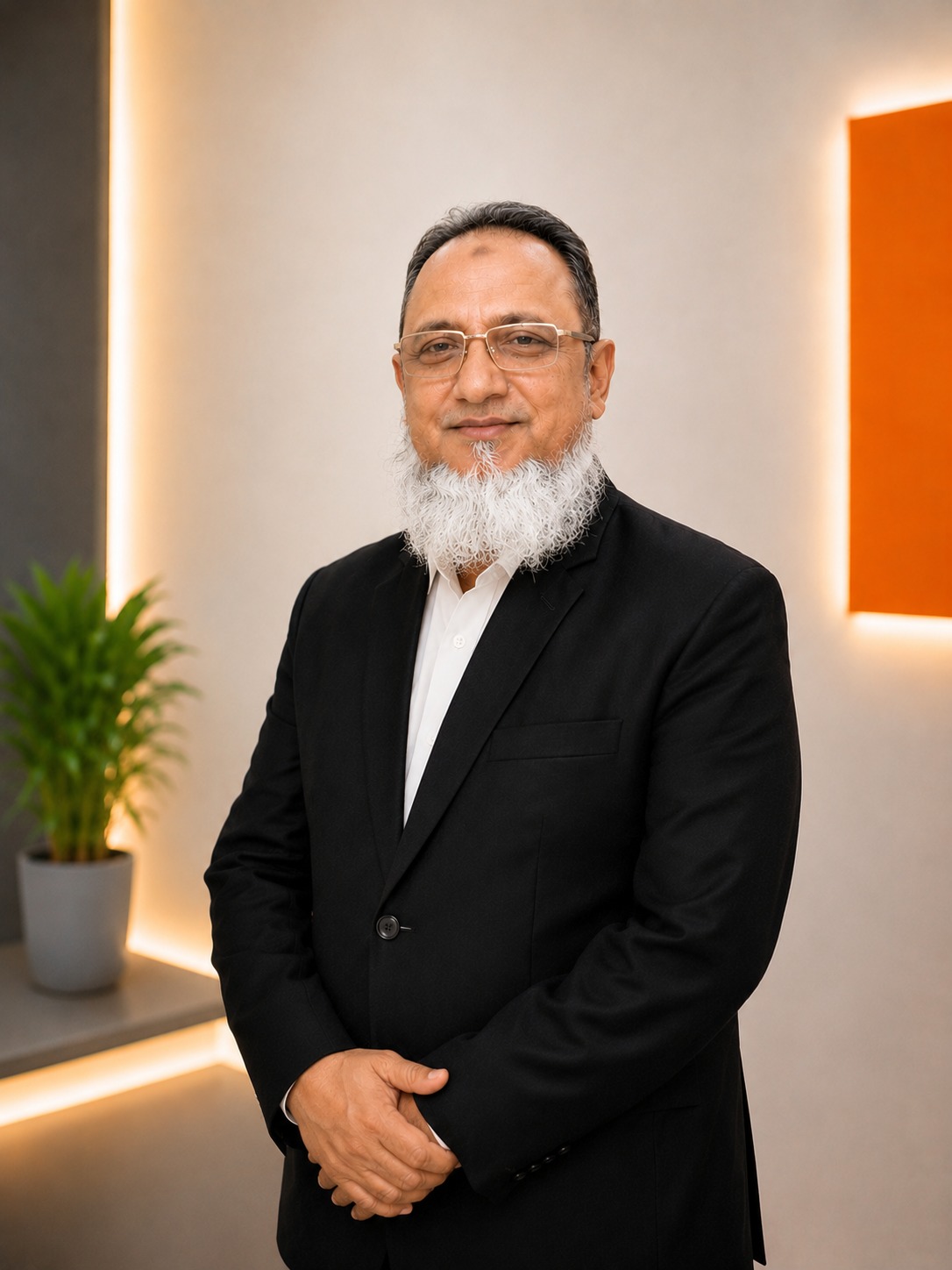 Professional Chief Executive headshot portrait of Syed Ali Asghar wearing a suit in a studio workspace